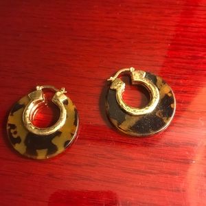 tortoise shell like earring hoops.